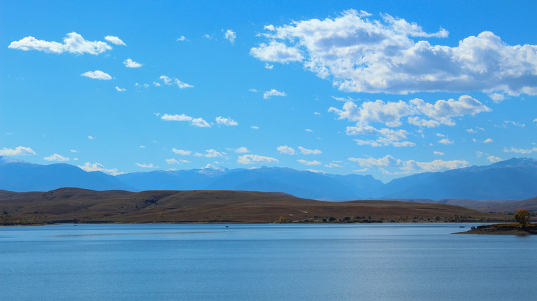 A view of the Cooney Reservoir landscape under blue skies
