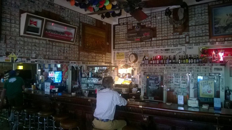 Person sitting at the bar at Ira's Old Corner Saloon, Copperopolis, California