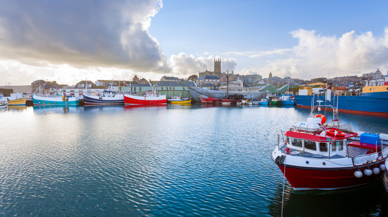 Colorful boats in the water at the Penzance harbor, England