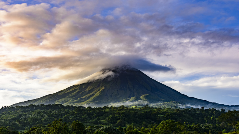 Clouds hover atop Arenal Volcano