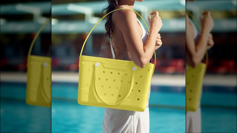 Woman holding a yellow Costco Beachcomber Bag