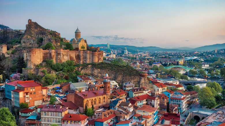 Tbilisi in Georgia's skyline as the sun begins to set