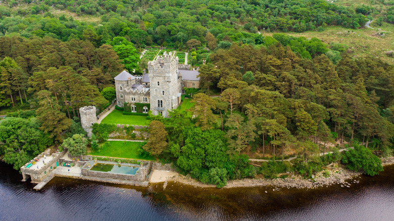 Aerial view of Glenveagh Castle, a large castellated mansion located in Glenveagh National Park.
