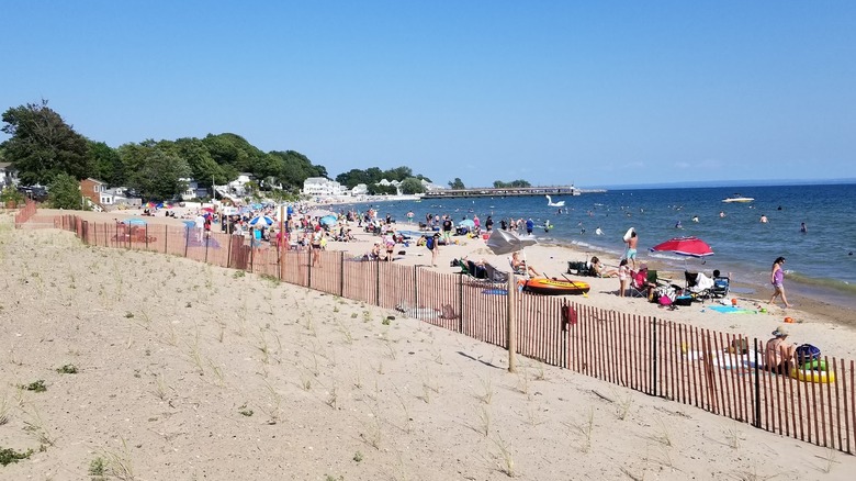 People swimming and lounging on Bay Beach in Crystal Beach, Ontario