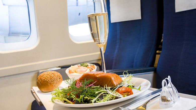 A salmon dinner and champagne on an airplane