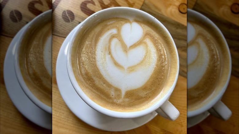 a hot latte on a wooden table