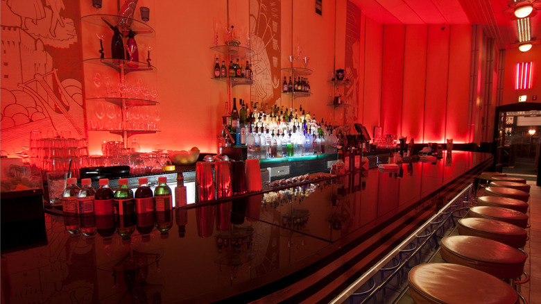 Red interior of the elegant The Cruise Room at The Oxford Hotel in Denver