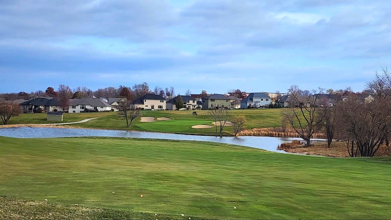 Lawn, water, and buildings viewed from The Legacy Golf Club, Norwalk, Iowa.