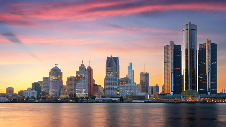 A view of the Detroit skyline and the Detroit River at sunset