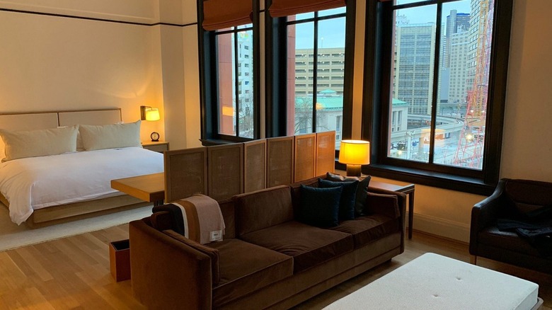 A guest room in the Shinola Hotel with a bed and a sitting area