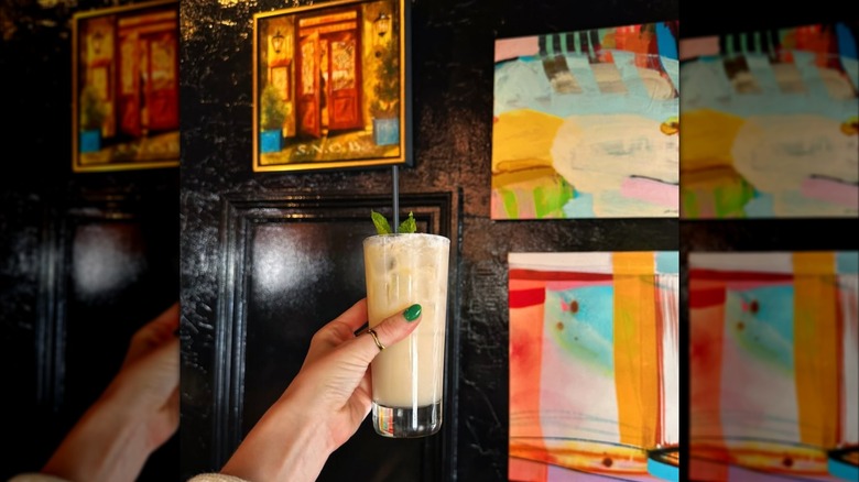 Hand holding a drink from Coco Pipa in the Castle Street Arts District in Wilmington, North Carolina