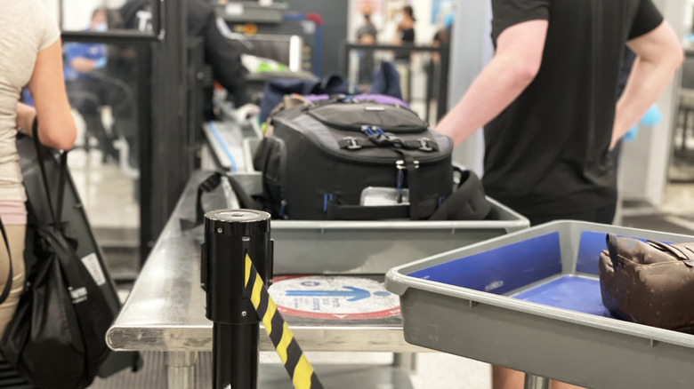 Travelers going through airport security