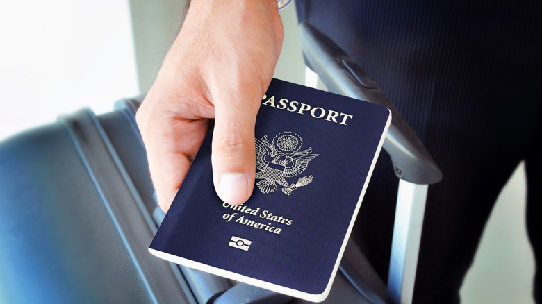 Close-up of a hand holding a U.S. passport