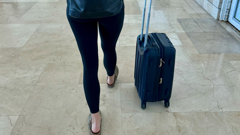 Person in leggings at the airport on the way to a flight
