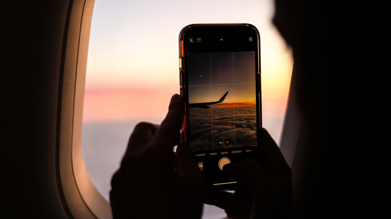 Taking a photo out airplane window with phone