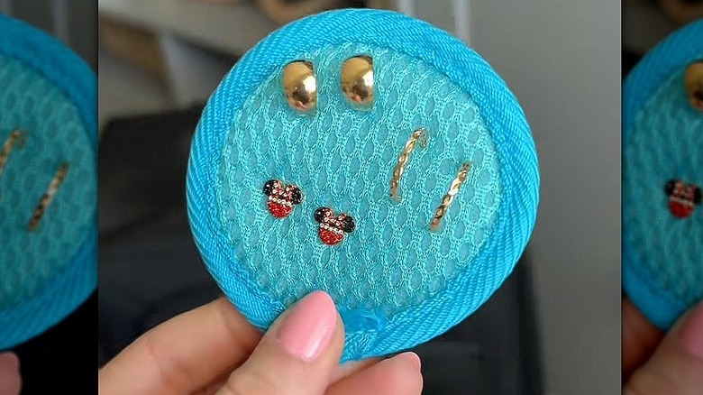Screenshot of exfoliating mitt used as earing holder