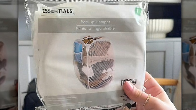 Pop up hamper packet being held up