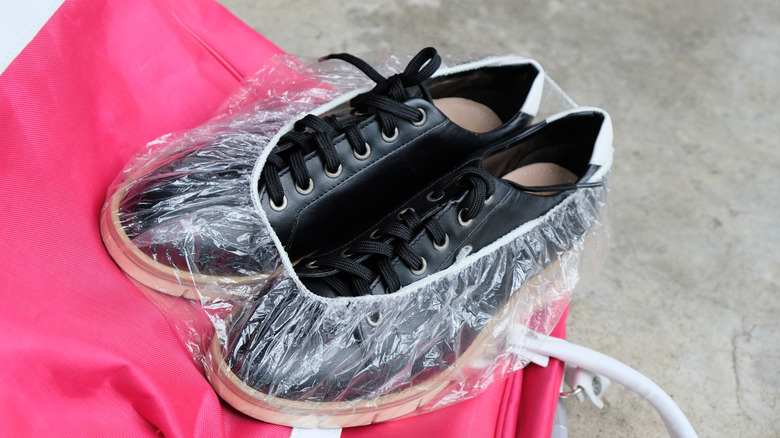 Shoes in shower cap