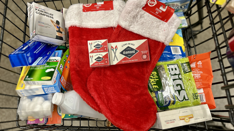 A cart filled with stockings and camping supplies at Dollar Tree