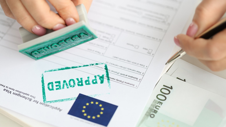 A stamp of approval on a Schengen Visa application
