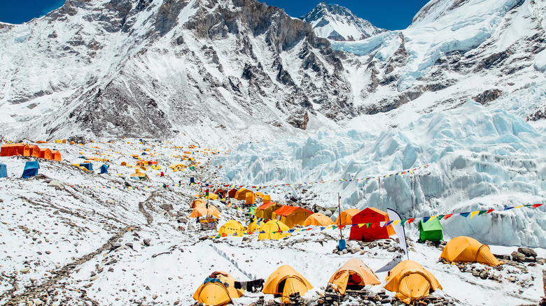 Colorful tents scattered across the snowy terrain at Mount Everest Base Camp