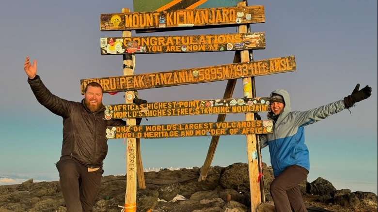 Couple at summit of kilimanjaro at sunrise