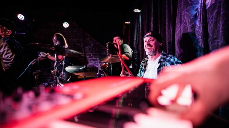 A band plays live music in a lounge setting