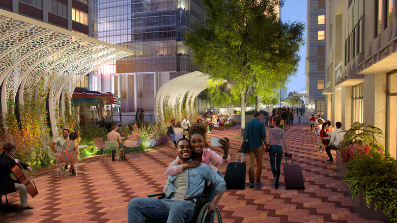 An architectural rendering depicts pedestrians walking and relaxing on Houston's Main Street Promenade in the evening
