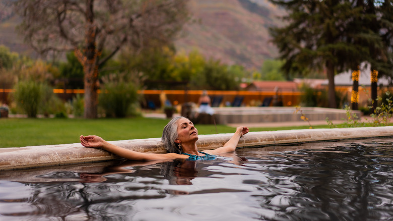 A woman relaxes in Durango Hot Spring Resort and Spa's soaking pool