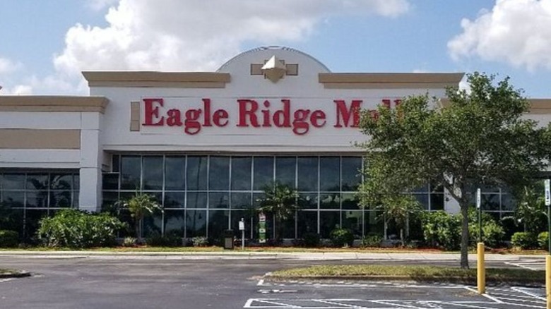 The front entrance of Eagle Ridge Mall with its red sign