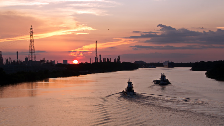 Boats in Neches River during sunset