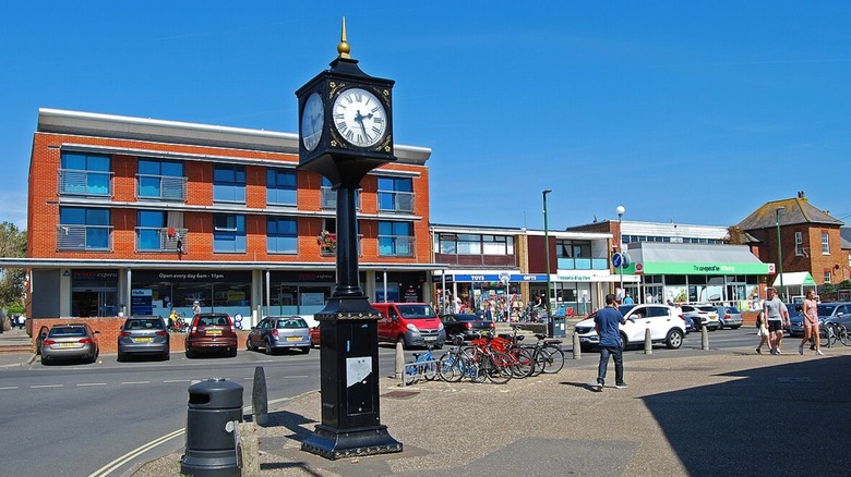 Shopping district with a standing clock on the corner