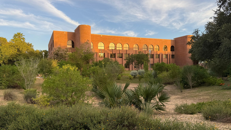 University of Texas Rio Grande Valley campus rust-colored facade with blue skies overhead