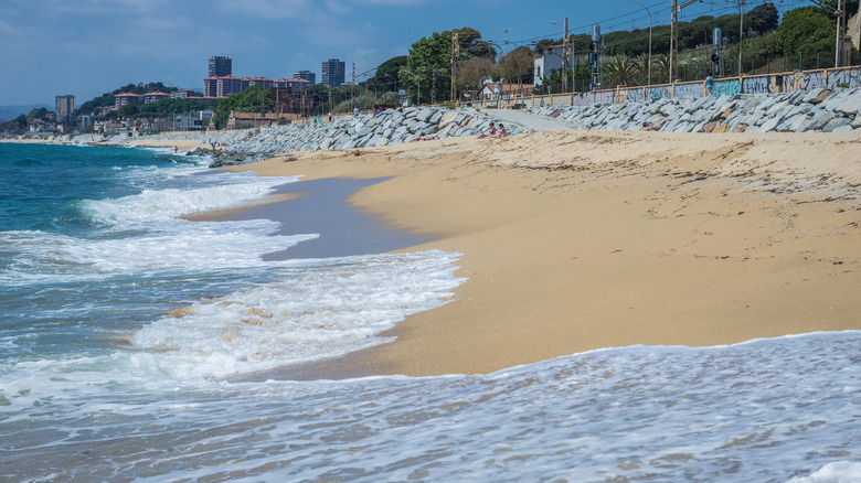 Waves lap beach in El Masnou