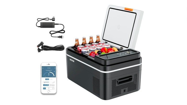 Close-up image of Vevor 22-liter portable mini-fridge in black, filled with fruit and beer, along with accessories