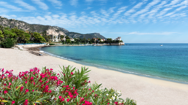 White sandy beach and clear blue sea in Saint-Jean-Cap-Ferrat, South of France