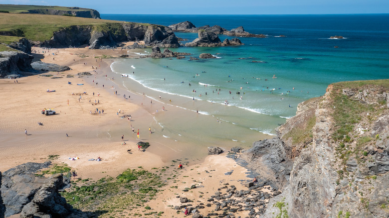 Beachgoers on Porthcothan Bay Beach, Cornwall