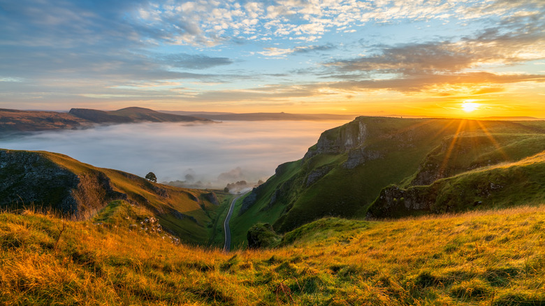 Sunrise across the hilly landscape in the Peak District National Park, England