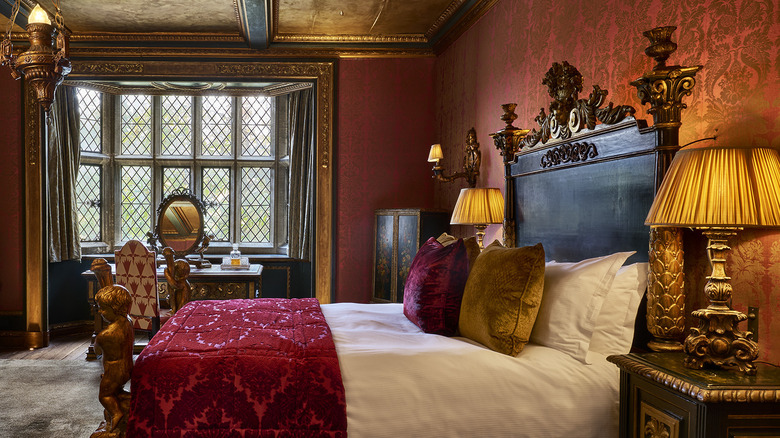 The bed and window in the Italian Suite at Great Fosters hotel