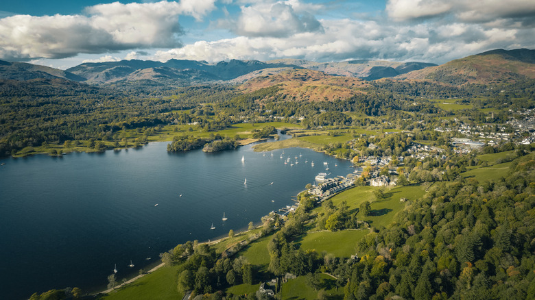 Verdant hills sloping into Lake Windermere on sunny day