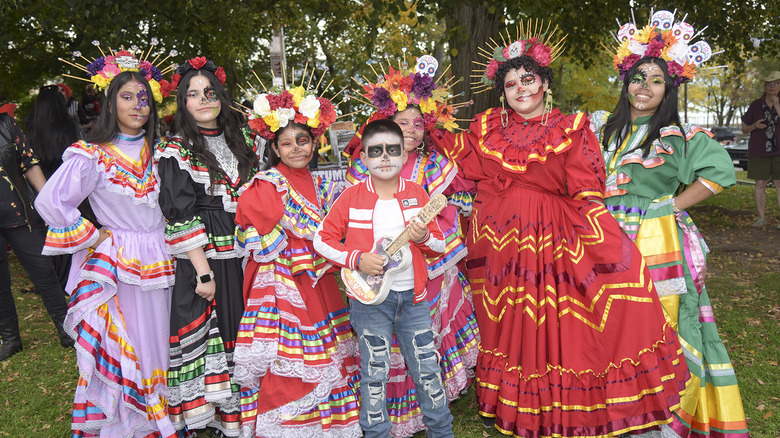Family dressed in halloween costumes