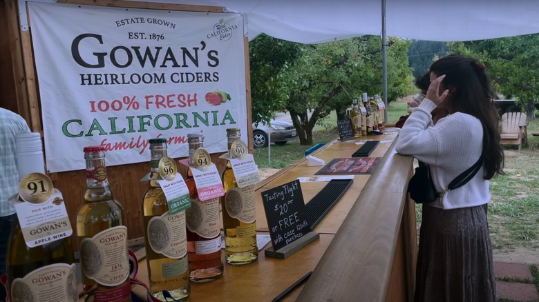 A woman tasting cider at Gowan's Heirloom Ciders