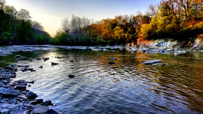 Autumn foliage and sunset over Salamonie River