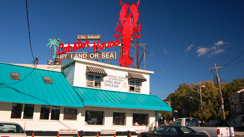 A large lobster sign at a seafood restaurant on City Island, New York