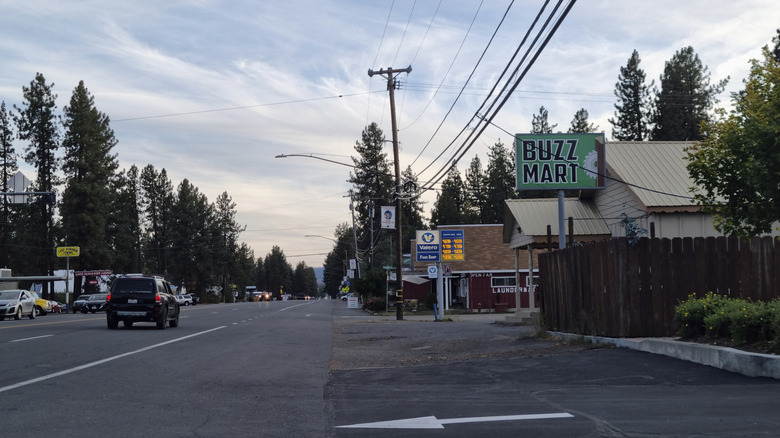 A car drives up the main street in Chester, California