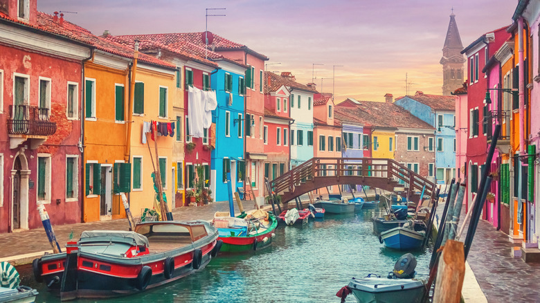 Colorful houses line canals on the island of Burano, Italy