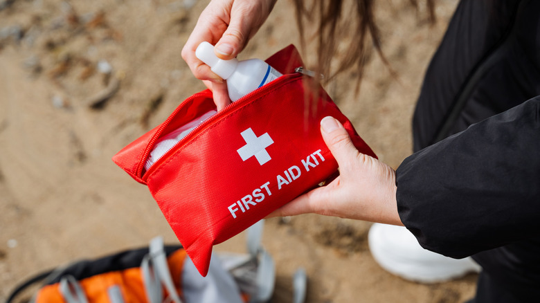 Woman packing a first-aid kit