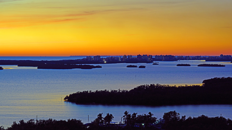 Water view of Estero Bay Preserve State Park at sunset