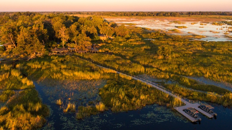 Aerial view of Wilderness Little Vumbura camp and boat dock