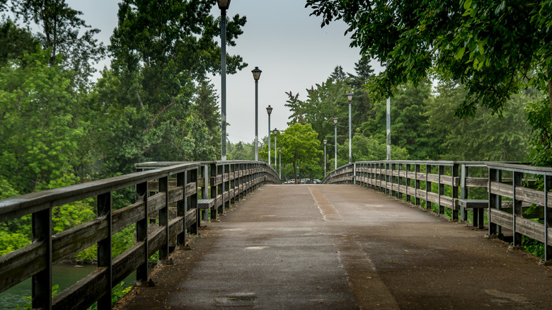 Small bridge over the Willamette River in Eugene, Oregon on a cloudy day.